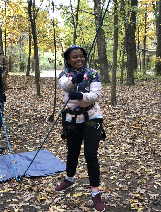 Smiling student about to zipline
